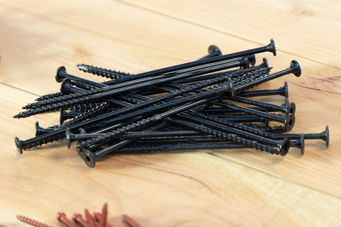 Heavy Duty Exterior Wood Screws With Aggressive Sawtooth Tip That Slides Right Into Lumber For No Sweat Install And Smooth Flush Heads With Ridiculous Grip On Your Next Deck Upgrade Pack Of Twelve Tan piled on a wooden surface.