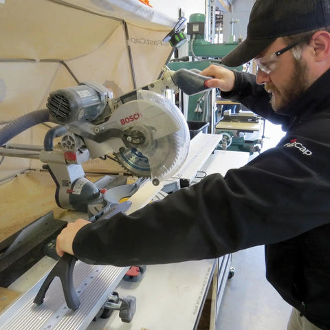 Person using 10 Million Dollar Stick For Safe Small Part Cutting With Wishbone Grip And Rubber Feet Injection Molded Standalone Holder