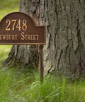 Cast Metal Address Plaque Lawn Mounted Arch Sign Personalized House Number And Street Name Made In The USA Durable Outdoor Nameplate With Custom Top Line Up To 7 Characters And Bottom Line Up To 17 Characters installed by a tree