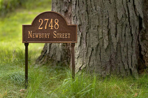 Cast Metal Address Plaque Lawn Mounted Arch Sign Personalized House Number And Street Name Made In The USA Durable Outdoor Nameplate With Custom Top Line Up To 7 Characters And Bottom Line Up To 17 Characters installed by a tree
