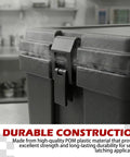 Beefy Black Draw Latches Two Hole Mounts POM Plastic Drawer and Cabinet Hardware Includes Two Latches and Four Screws Built for Heavy Duty Seals on Drawers and Cabinets Two Pack Bundle mounted on a black container in a kitchen setting.