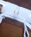 Close-up of 4.4 Yard Synthetic Silk Ito Tsukamaki Sageo Cord, white, wrapped on katana scabbard for DIY sword maintenance, 400cm