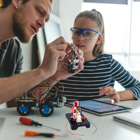Adults assembling DIY Electric Motor Kit for Hands-On Learning, Simple 3V and 6V DC Motor Model Kit with tools and tablet in science lab