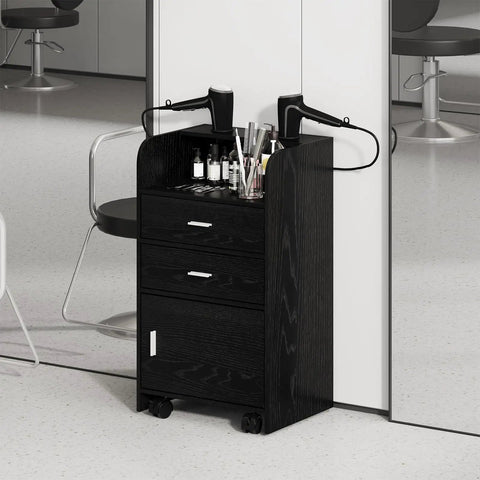 Mobile Salon Station On Wheels For Hair Stylists And Barbers Sleek Black Trolley Cart With Swivel Casters Pro Grade Organizer For Spa Nail And Beauty Tools Easy Move With Ample Storage Drawers in a salon setting, featuring two drawers and tool holders.