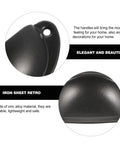 Close-up of Vintage Iron Drawer Pull Handles Set 12 Pieces Retro Cabinet Knobs Black Painted Shell Shape for dresser use.