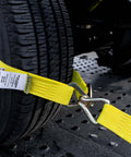 Complete Axle Strap Tie Down Kit With Wire Hook Ratchet Straps In Classic Yellow securing vehicle wheel on trailer