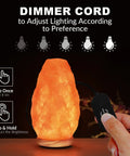 Hand adjusting dimmer on Himalayan Salt Lamp USB Powered With Touch Dimmer Natural Pink Crystal 5 To 7 Lbs Neem Wood Base LED Bulb ETL Certified