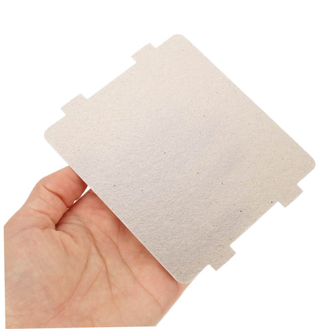 Hand holding a 10Pcs Microwave Oven Mica Sheet, replacement part for heat resistance and insulation, protects microwave from burnout.