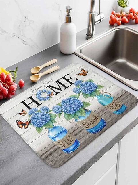 Hydrangea Pattern Dish Drying Mat for Kitchen Counter 16x18 Inches with farmhouse wood grain and blue jars next to a sink