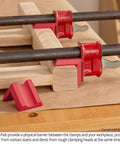 Heavy Duty Woodworking Clamp Pads 12 Pack Shield Boards From Nasty Glue Residue And Dent Marks Universal Fit On Bar And Pipe Clamps used on wooden boards.