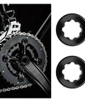 Two Pack Aluminum Crank Adjusting Caps With Tool For Shimano Deore XT SLX XTR UT DA M20 Hollow Cranksets Crank Cover Screws Nuts Bolt Black Durable Aluminum Alloy Construction For Weather Resistant Performance showing bike crankset and two crank covers