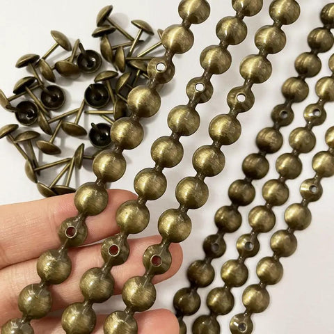 Brass Nailhead Upholstery Strips Kit For Sofas Headboards And Benches, 9.5mm Brass Tacks, 10 Strips Total 10 Meters shown in hand