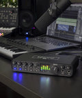 USB-C 6x4 Audio Interface With Pro-Grade Studio-Quality Sound And ESS Sabre32 DAC, 120 dB Dynamic Range on a music production desk