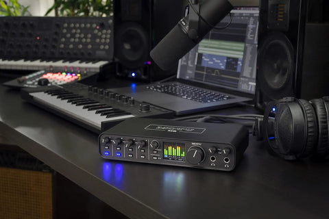 USB-C 6x4 Audio Interface With Pro-Grade Studio-Quality Sound And ESS Sabre32 DAC, 120 dB Dynamic Range on a music production desk