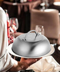 Chef holding 9 Inch Griddle Dome Cover for Smash Burgers and Melting Basting Shield for Flat Top Grills Stainless Steel Heavy Duty
