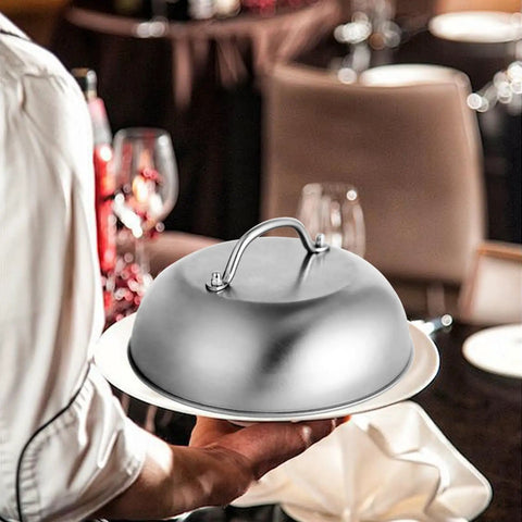 Chef holding 9 Inch Griddle Dome Cover for Smash Burgers and Melting Basting Shield for Flat Top Grills Stainless Steel Heavy Duty