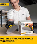 Man sanding wood with Dust Free Sanding Mesh Discs 150 Grit 5 Inch Hook and Loop Sandpaper for Wood Metal Automotive and Furniture Finishing