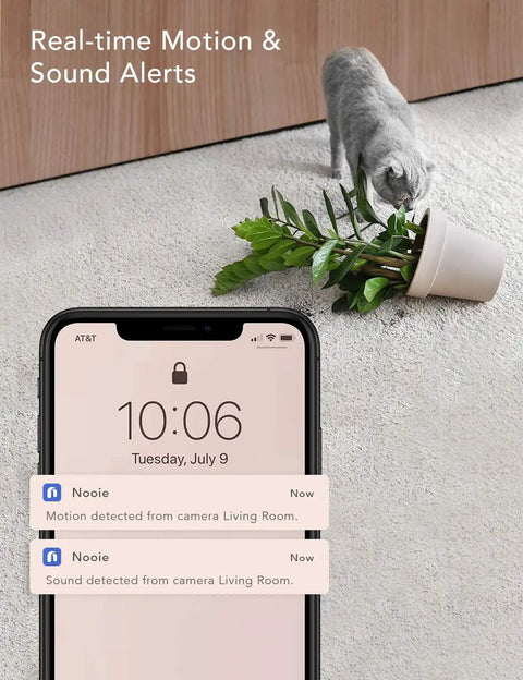 2K Indoor WiFi Baby And Pet Camera With 360 Degree Pan And Tilt AI Motion Tracking Crystal Clear Night Vision Two Way Audio Motion And Sound Alerts Alexa Compatible Easy Setup No Sweat Peace Of Mind monitoring notifications on smartphone while a cat tips over a potted plant on carpet.