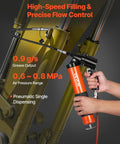 Person using Pro Grade Heavy Duty 6000 PSI Grease Gun Kit With Pistol Grip to lubricate machinery, showing pressure control.