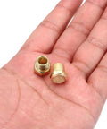 Eight-Piece 1/8 NPT Pneumatic Exhaust Muffler Kit with sintered bronze fittings shown on a hand for scale, reducing noise and pressure.