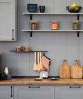 Rock Solid Metal Shelf Brackets Four Inch Square Design With Heavy Duty Wall Mounting Hardware Easy Peasy Installation For Countertops And Floating Shelves, holding kitchen items and decorations on shelves.