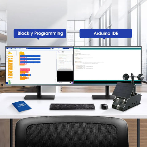 Computer screens displaying blockly and Arduino IDE with Ultimate ESP32 Weather Station Kit For IoT Nerds on desk.