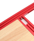 Heavy Duty Adjustable Router Jig For Cutting Boards close-up showing sturdy red aluminum frame and wooden base setup.