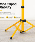 Wide base of an adjustable foldable metal archery target stand with tripod design featuring fold-out legs for outdoor stability.