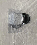 Heavy Duty Shower Head Holder With Tough As Nails Adhesive in use, water flowing over waterproof chrome finish on wall mount bracket