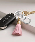 Top Shelf Zinc Alloy Lobster Clasps And Keyrings 10 Pack with key, tassel, and silver lobster clasp on a table