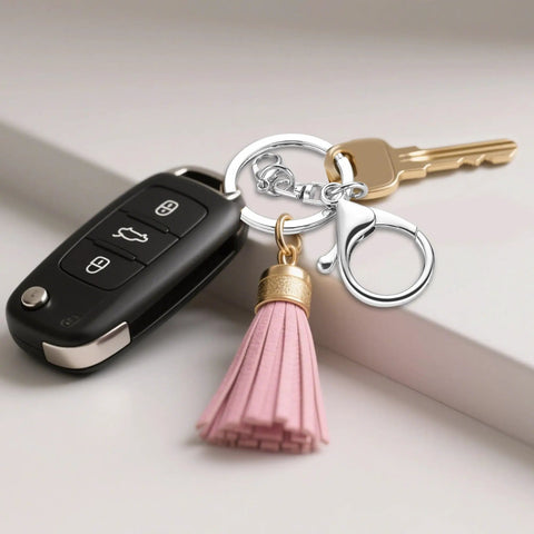 Top Shelf Zinc Alloy Lobster Clasps And Keyrings 10 Pack with key, tassel, and silver lobster clasp on a table