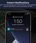 Smart Garage Door Opener With Built In 1080P Video, showing phone alert "Garage Door has been left open" from Wyze app.