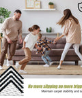 Family playing on carpet secured by Ultra Thin Non Slip Rug Tape For Hardwood Floors, Double Sided Adhesive Rug Stickers by the couch.