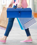 Person carrying a Blue Iron Toolbox With Heavy Duty Lock And Steel Reinforced Corners Comfortable Grip Bar for shopping.