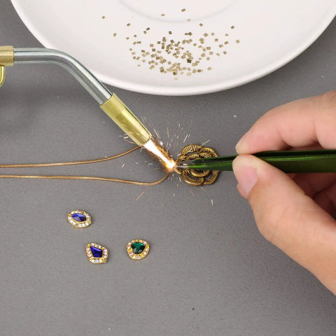 Using Gold-Plated Alloy Solder Chips 1x1mm, 0.5g Pack (About 200 Pieces) With 2% Gold for jewelry repair with a soldering iron