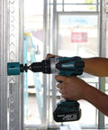 Rock Solid Eighteen Volt Cordless Hammer Driver Drill Kit Featuring Killer Torque Two Speed Gears And Hella Durable Ergonomic Build For Quick Drilling And Straight Up Fastening Projects Plus Long Lasting Battery Life in use on metal stud.