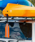 Orange Safety Travel Flag For Kayak And Canoe With Reflective Stripe attached to roof rack of car with kayak