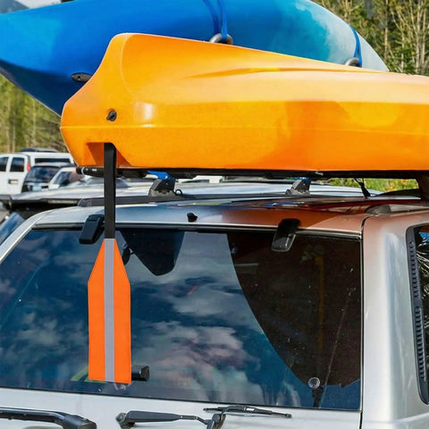 Orange Safety Travel Flag For Kayak And Canoe With Reflective Stripe attached to roof rack of car with kayak