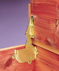Brass Cedar Chest Hinge And Lid Support Set installed inside wooden chest showing brass finish, no screws included