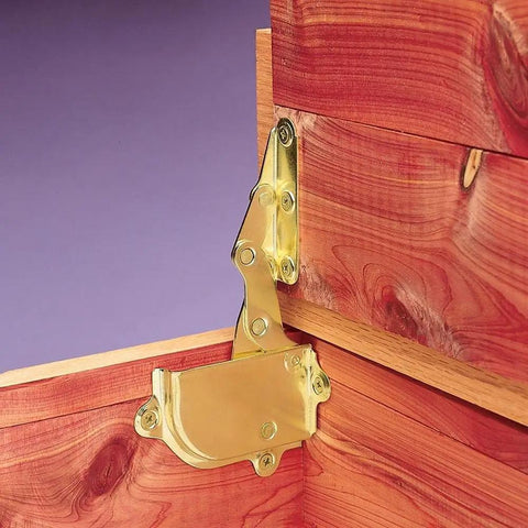 Brass Cedar Chest Hinge And Lid Support Set installed inside wooden chest showing brass finish, no screws included