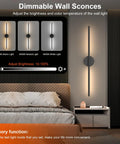 Set Of Two Rechargeable Battery Wall Sconces With Remote Dimming 3000K To 6000K Adjustable Led Light mounted beside a bed.