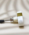 Side view of Oval Stone And Brass Knob Set For Drawers And Cabinets 1.5 Inch, showing gold white finish and durable construction.