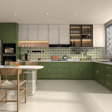 Modern kitchen with green and white cabinets, tiled backsplash, and dining area
