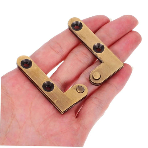 Heavy Duty Brass Hidden Door Pivot Hinges For Wood Doors Smooth Vertical Rotation, held in hand, showcases material and design.
