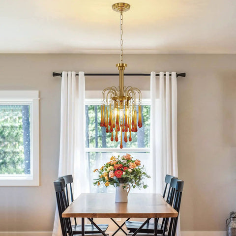 Gold Crystal Pendant Light Fixture For Dining Room And Kitchen Island above dining table with flowers