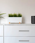 Modern dresser with 30 Pack 4 Inch Satin Nickel Cabinet Pulls, showcasing sleek design and functionality in a minimalist white decor.