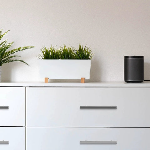 Modern dresser with 30 Pack 4 Inch Satin Nickel Cabinet Pulls, showcasing sleek design and functionality in a minimalist white decor.