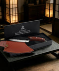 Hand Forged Meat Cleaver With Leather Sheath For Everyday Kitchen Prep in black box on table