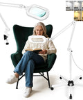 12X Magnifying Glass With Light And Stand in use, showing large 6 by 4 inch optical glass lens on rolling base floor lamp.