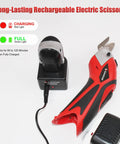 Heavy Hitter Dual Blade Cordless Electric Scissors With Rechargeable Battery Power Cutter charging next to charger.